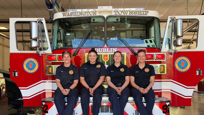 Firefighter Squad sitting on firetruck