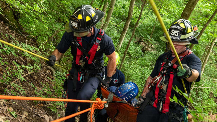 Paramedics rescuing someone in the forest